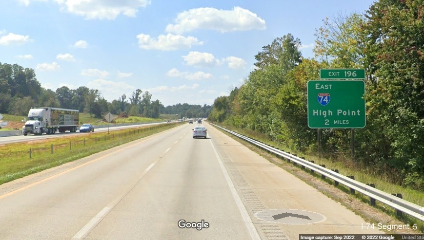 Image of ground mounted 1 mile advance sign for East I-74 exit with removed US 311 South information 
                                          on I-40 West in Forsyth County, September 2022