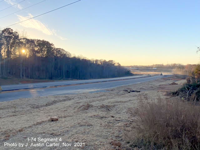 Image of view looking northwest from near Stanleyville Drive showing construction of the I-74/Winston 
        Salem Northern Beltway toward University Avenue, by J. Austin Carter, November 2021