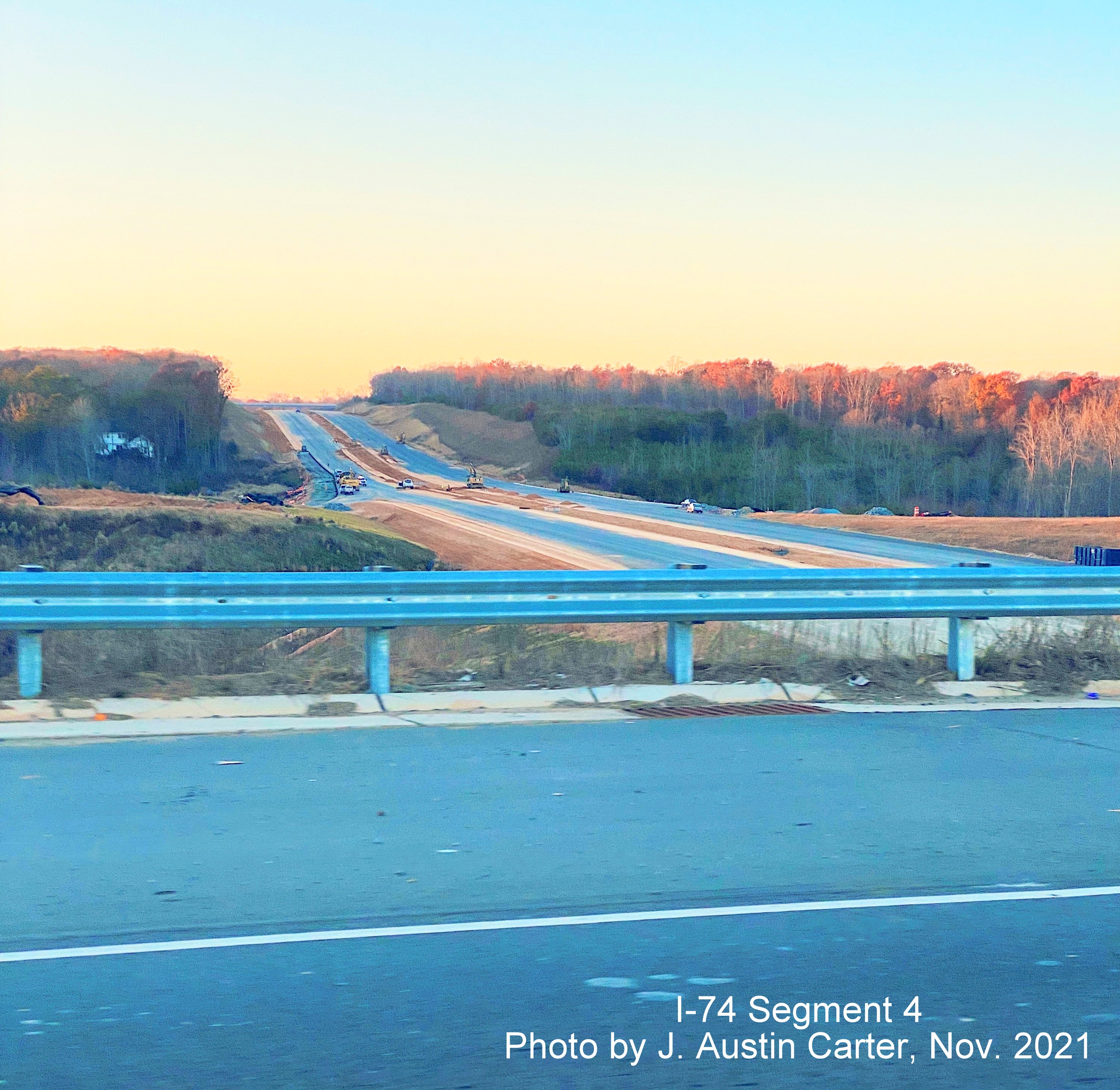 Image of view north/west from NC 8 / Germanton Road near bridge along future I-74 / Winston Salem 
        Northern Beltway toward Stanleyville Drive, by J. Austin Carter, November 2021