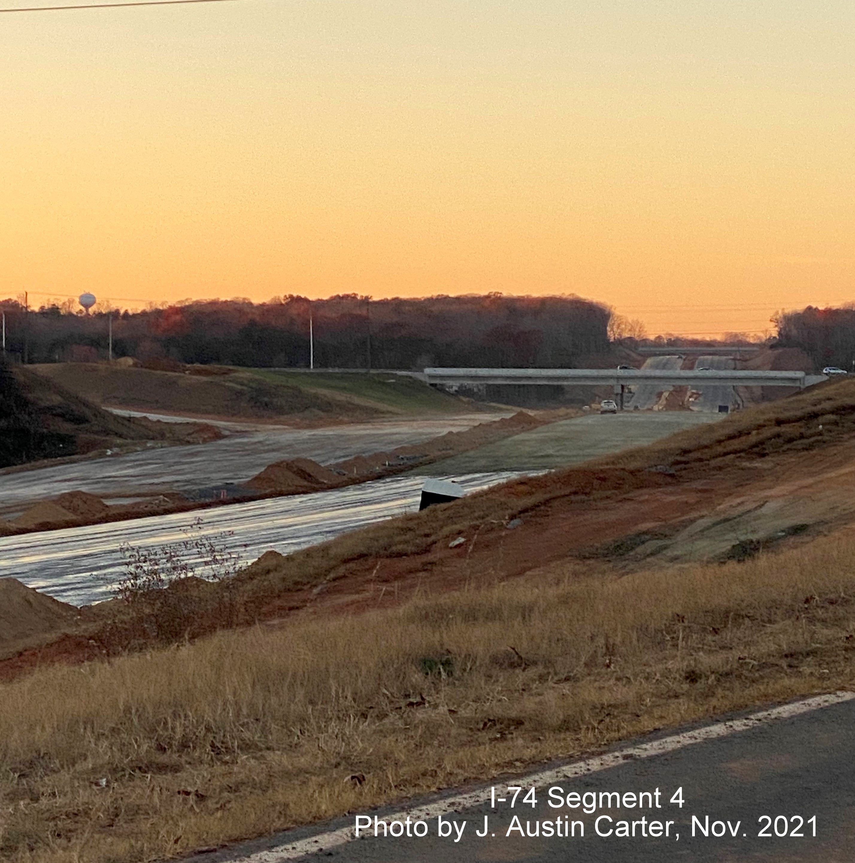 Image of I-74/Winston Salem Northern Beltway construction looking west from Merrydale Drive toward 
           new bridge for Merry Valley Lane, by J. Austin Carter, November 2021