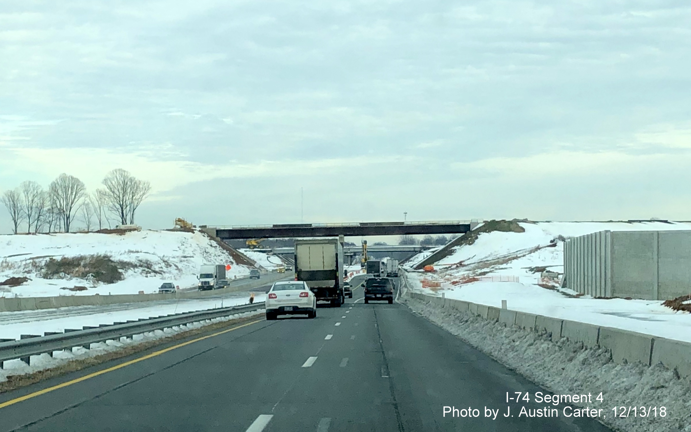 Image of flyover ramp for Future I-74/Winston Salem Northern Beltway under construction over 
        Business 40 freeway east of Winston-Salem, by J. Austin Carter