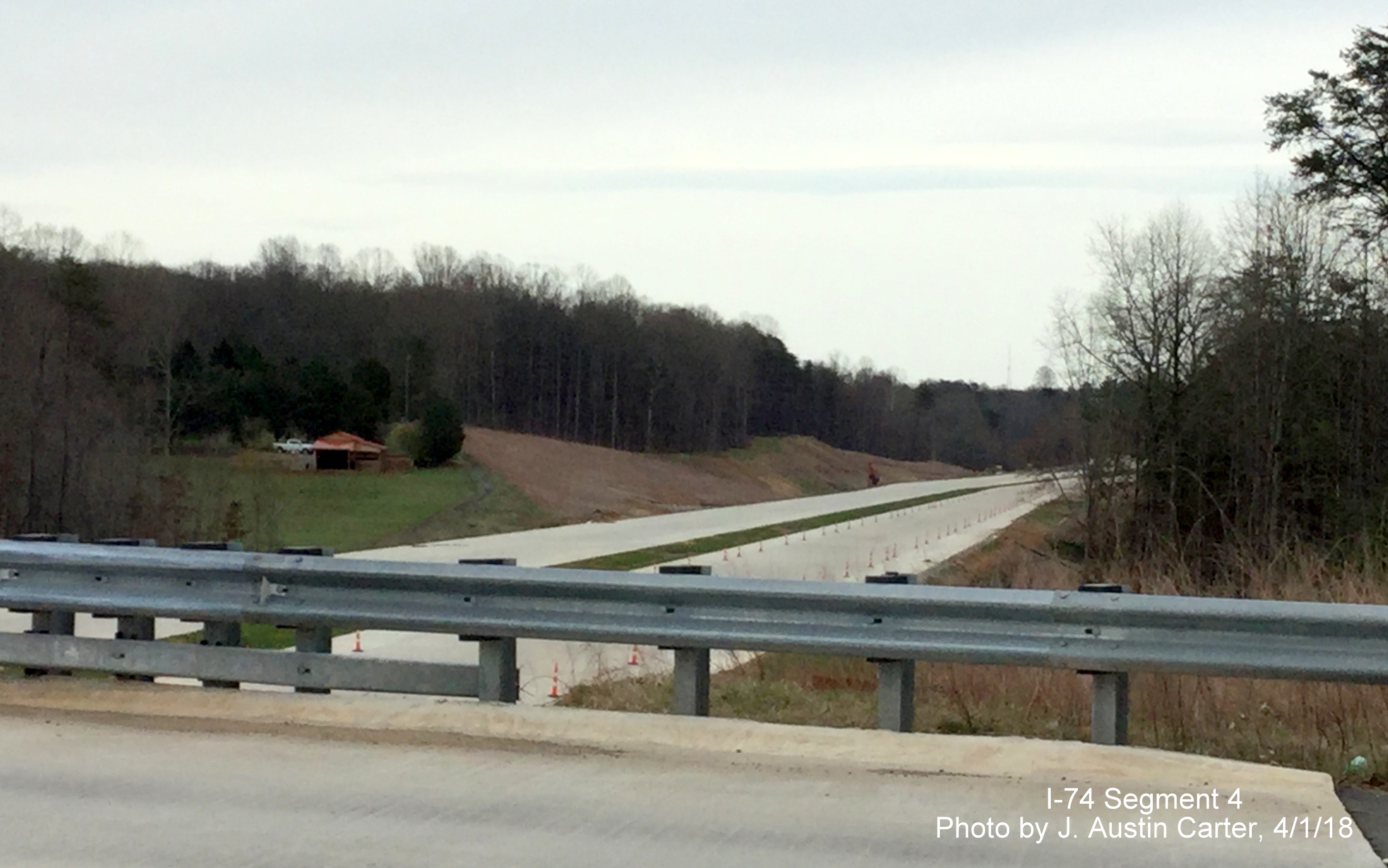 Image of completed Winston-Salem Beltway roadbed looking east/south toward W. Mountain St, by J. Austin Carter