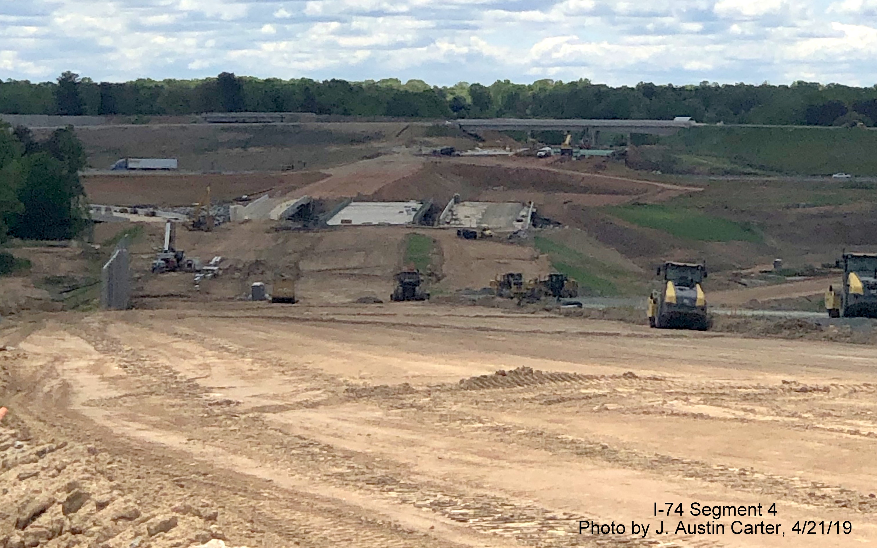 Image showing view from hill with graded lanes for Future I-74/Winston-Salem Northern Beltway looking over future Bus. 40/US 421 interchange, by J. Austin Carter