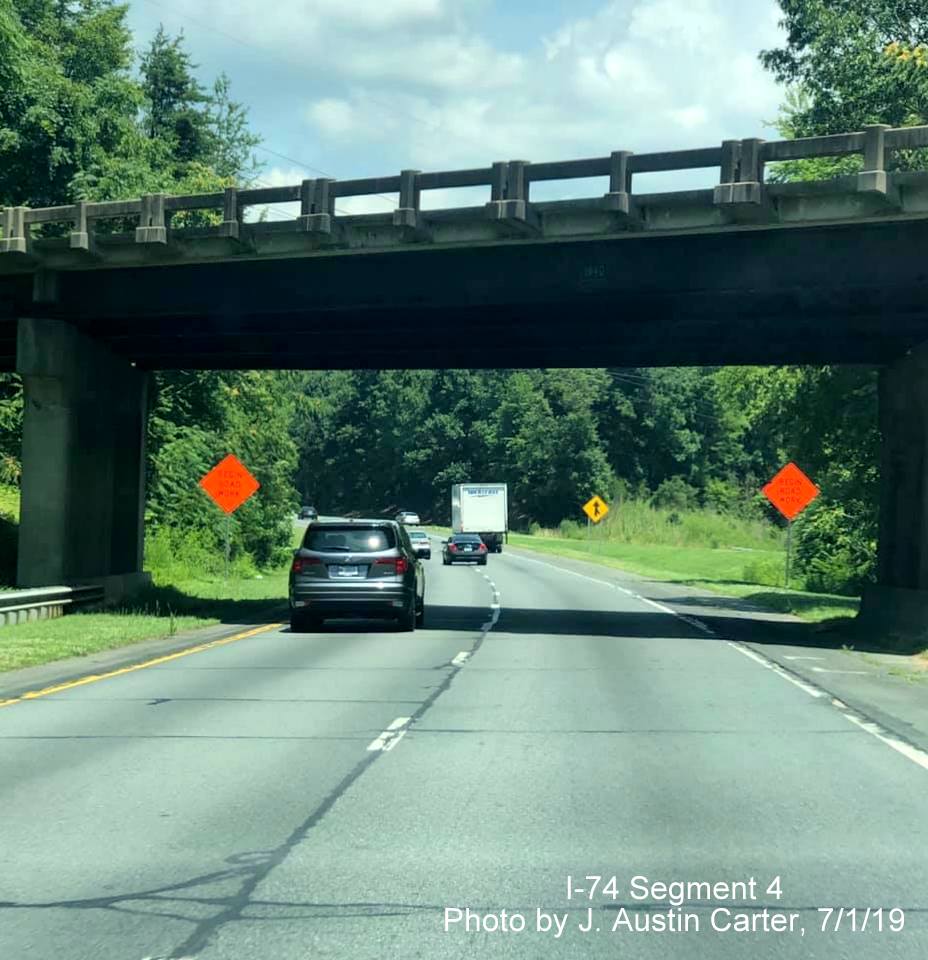 Image of traffic traveling under ramp to NC 66 from US 52 South on US 52 North, the site of the future I-74/Winston-Salem Northern Beltway interchange, by J. Austin Carter