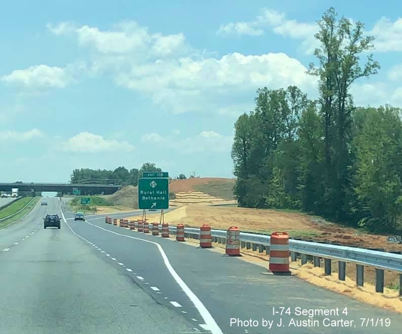 Image of newly placed guardrail for new off-ramp to NC 65 from US 52 South/Future I-74 East in Winston-Salem Northern Beltway interchange project work zone, by J. Austin Carter