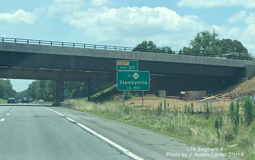 Image of 1/4 mile advance sign for NC 66 exit in front of new bridge being built as part of Winston-Salem Northern Beltway interchange on US 52 South/Future I-74 East, by J. Austin Carter