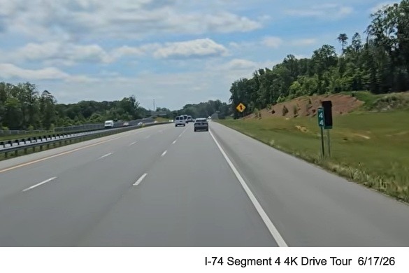 Image of covered up I-74 milepost next to NC 74 version along the
Beltway headed east, screen grab from 4K Drive Tour video, June 17, 2026