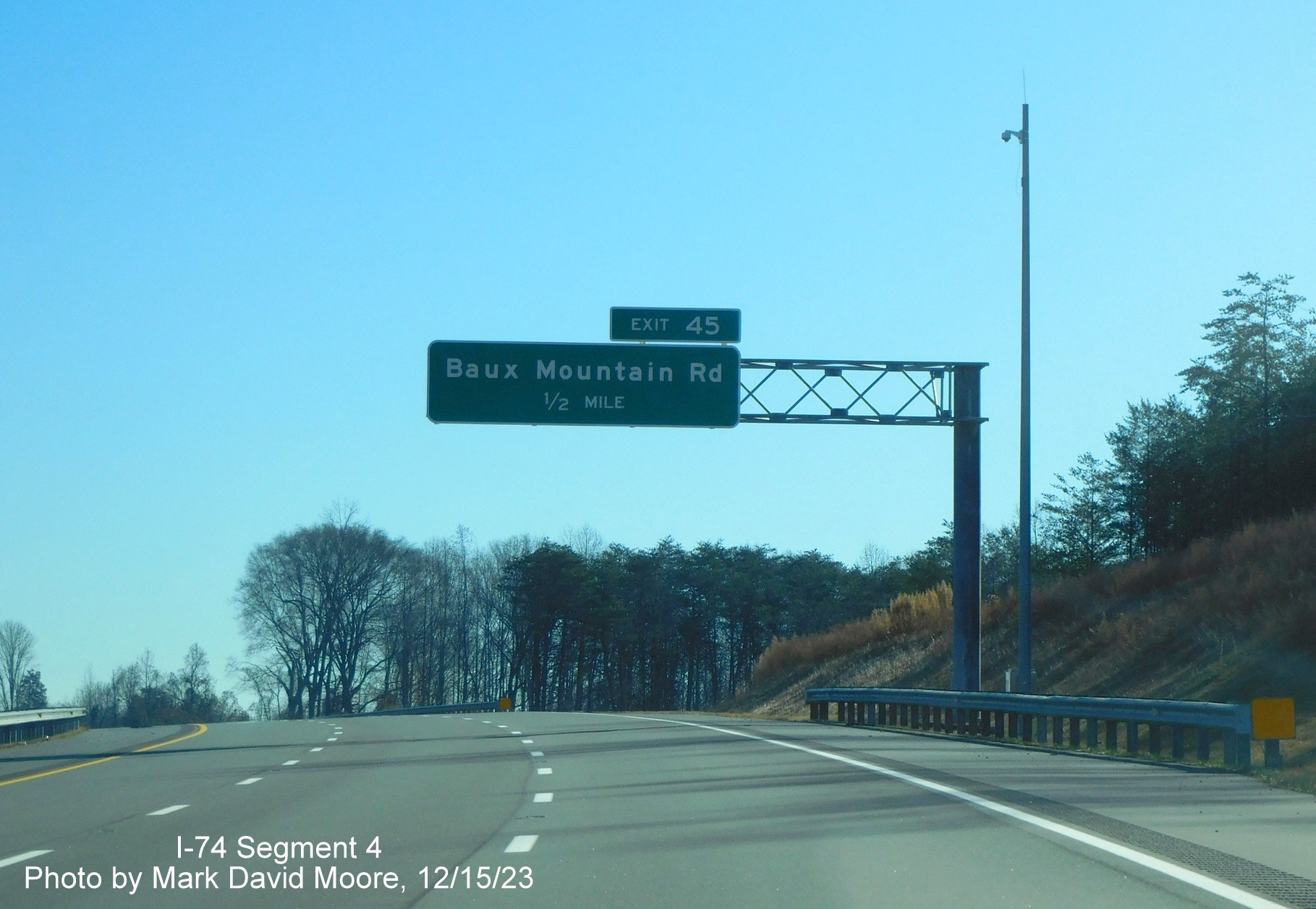 Image of 1/2 Mile advance overhead sign for Baux Mountain Road exit on NC 74 (Future I-74) East/
        Winston-Salem Northern Beltway, by Mark David Moore, December 2023