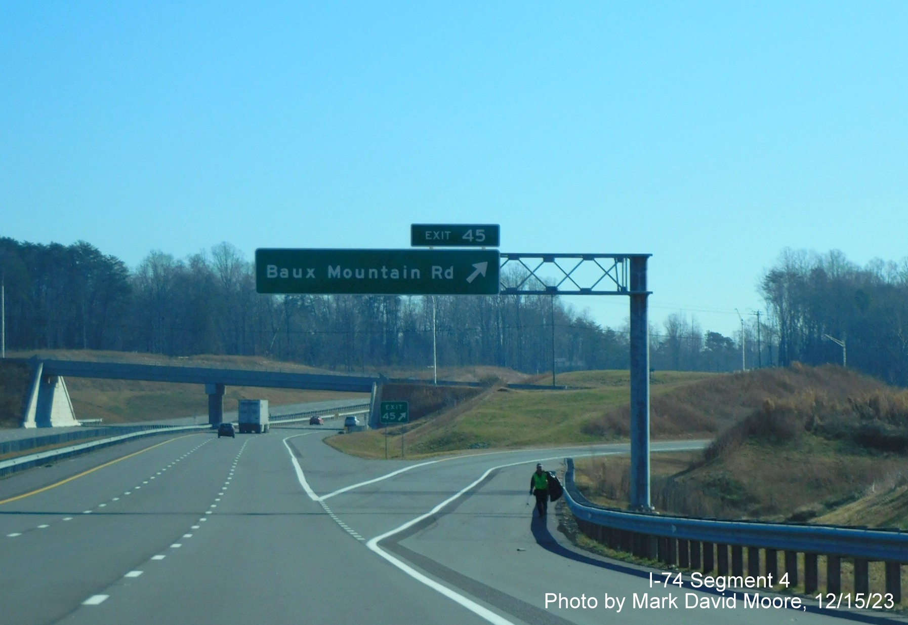 Image of the overhead ramp sign for the Baux Mountain Road exit on NC 74 (Future I-74) East/
        Winston-Salem Northern Beltway, by Mark David Moore, December 2023