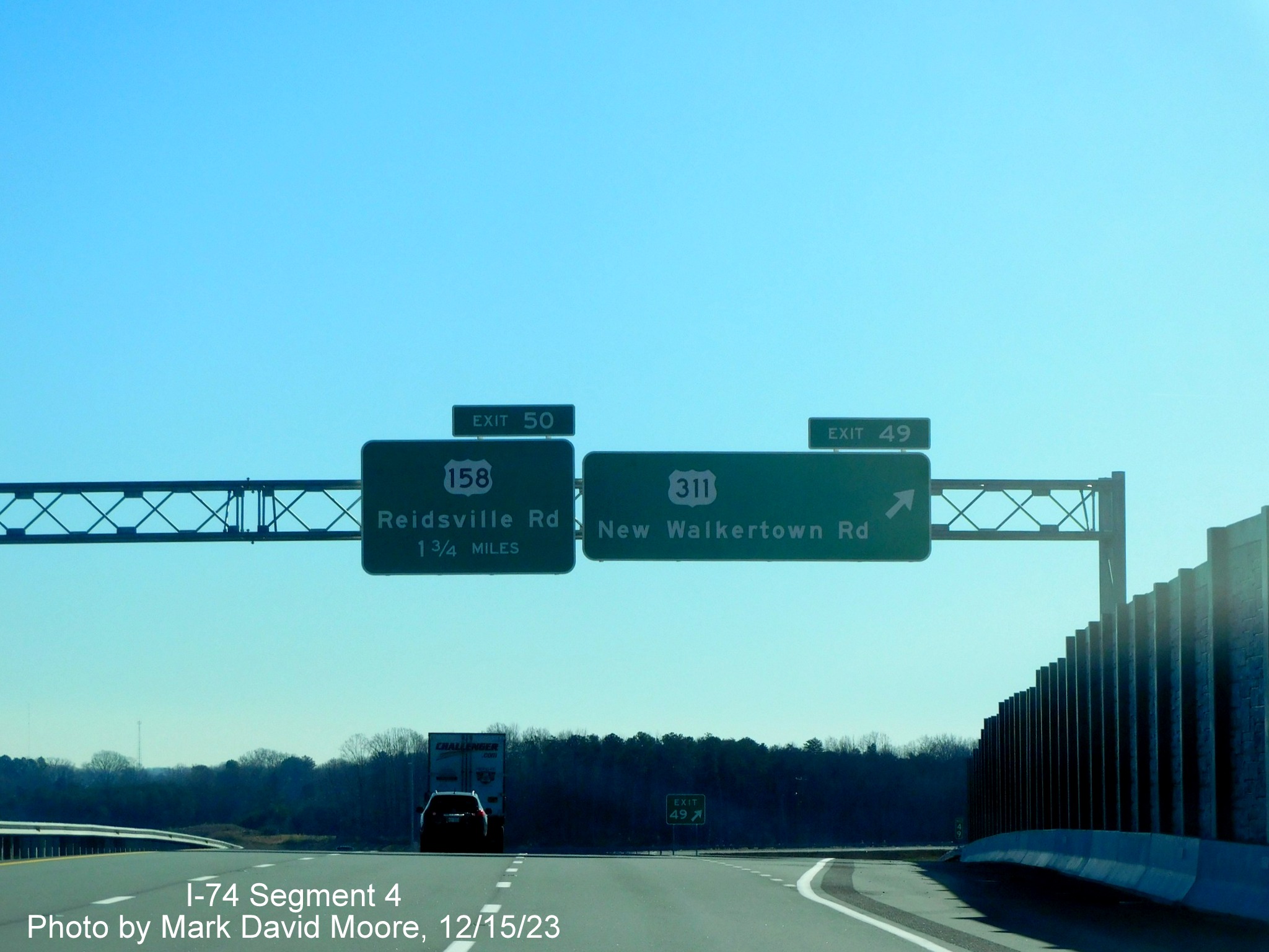 Image of overhead signage at US 311 exit on NC 74 (Future I-74) East/Winston-Salem Northern
        Beltway, by Mark David Moore, December 2023