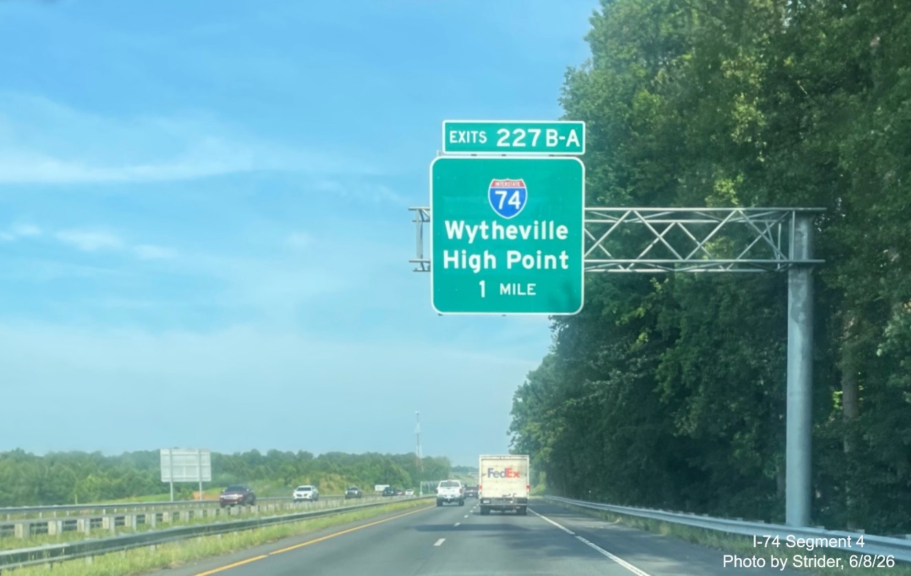 Image of new I-74 1 mile advance sign, in unusual font, approaching the Beltway
interchange on US 421 North, photo by Strider, June 2026