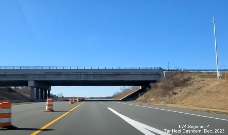 Image of newly opened lane of NC 74 (Future I-74) West after on-ramp from NC 66 exit, 
        from video by Tar Heel Dashcam, December 2023