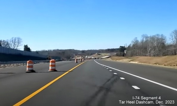 Image of newly opened lane of NC 74 (Future I-74) West after the NC 66 bridge heading towards
        US 52, from video by Tar Heel Dashcam, December 2023
