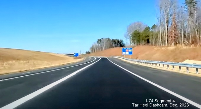 Image of current NC 74 (Future I-74) West lanes approaching merge with US 52 lanes prior to 
        NC 65 exit, from video by Tar Heel Dashcam, December 2023