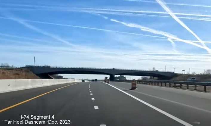 Image of NC 74 (Future I-74) East traffic after splitting off from US 52 South using future I-74 West/ 
        US 52 North lanes, from video by Tar Heel Dashcam, December 2023