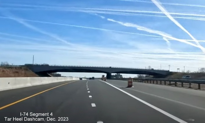 Image of NC 74 (Future I-74) East traffic after splitting off from US 52 South using future I-74 West/ 
        US 52 North lanes, from video by Tar Heel Dashcam, December 2023