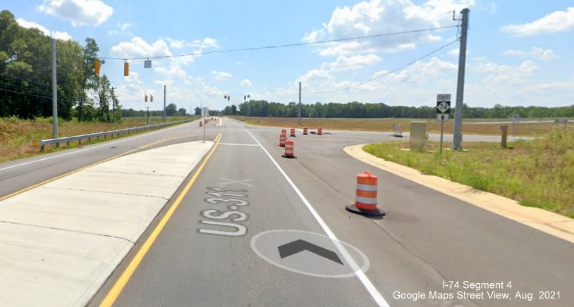 Future ramp to NC 74/Winston-Salem Northern Beltway ramp blocked by traffic barrels, 
        Google Maps Street View, August 2021