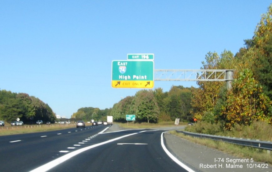 Image of overhead ramp sign for I-74 East exit on I-40 East in Winston-Salem with 
        dropped South US 311 information, October 2022