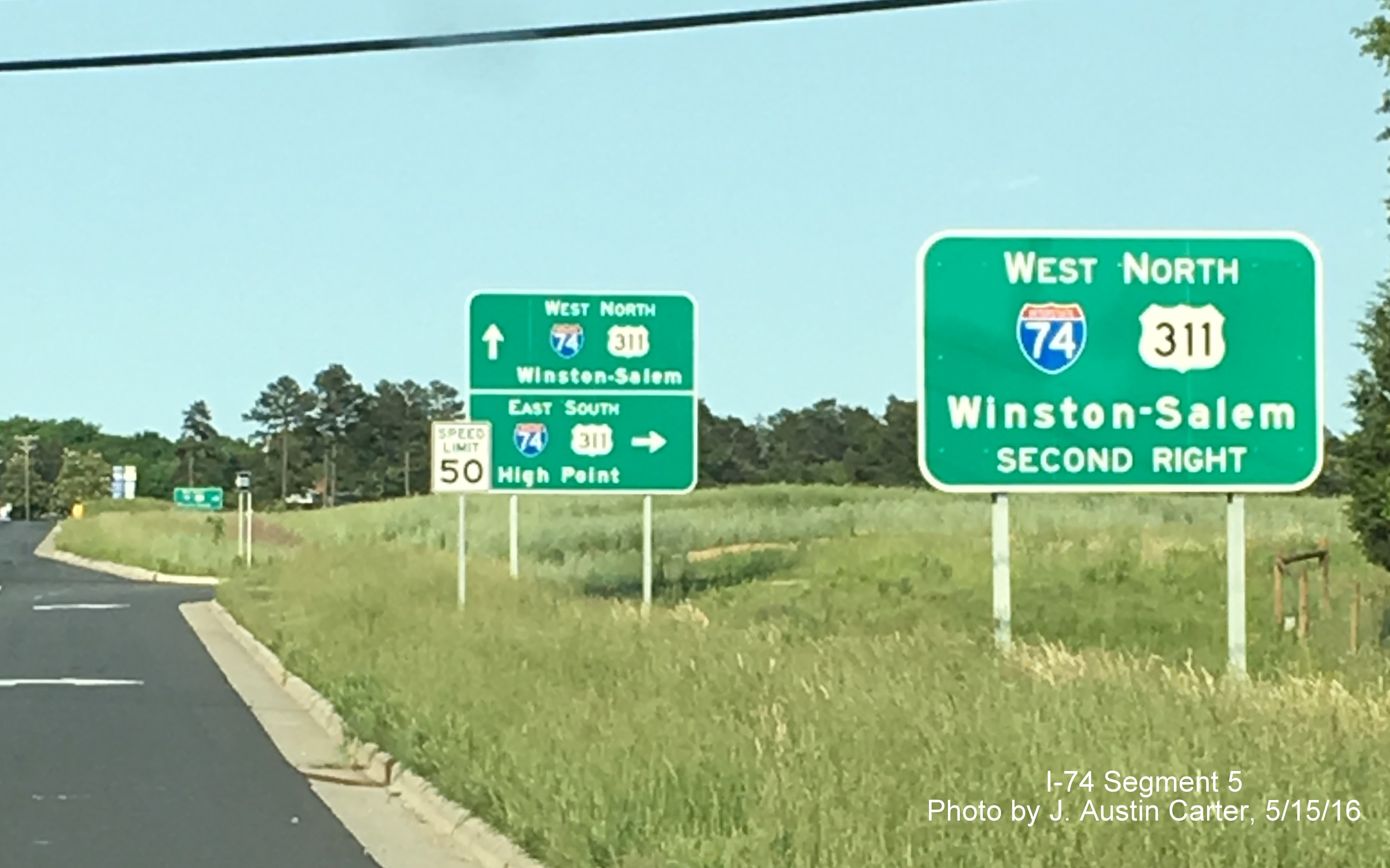 Image of new guide signs for I-74 and US 311 put up on widened Union Cross Rd, from J. Austin Carter