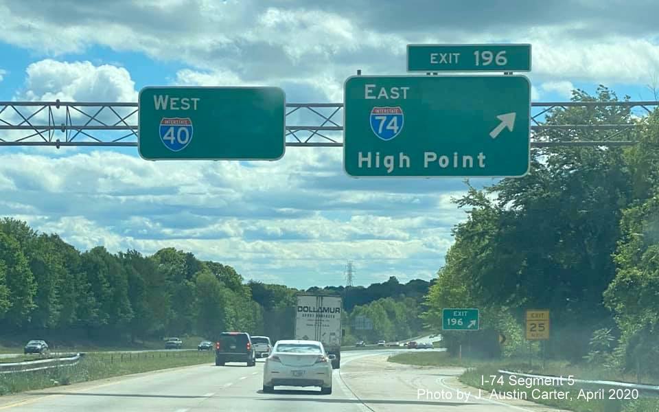 Image of overhead signs on I-40 West at I-74 in Winston-Salem with US 311 shields removed, by J. Austin 
                                         Carter in April 2020