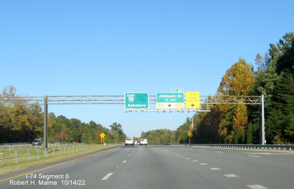 Image of East I-74 pull through sign with blank space from removed South US 311 information on I-74 
        East in High Point, October 2022