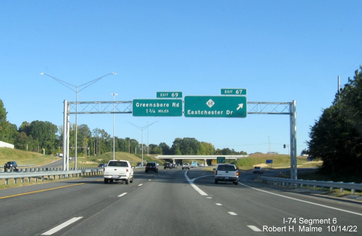 Image of East I-74 pull through sign with blank space from removed South US 311 information on I-74 
        East in High Point, October 2022