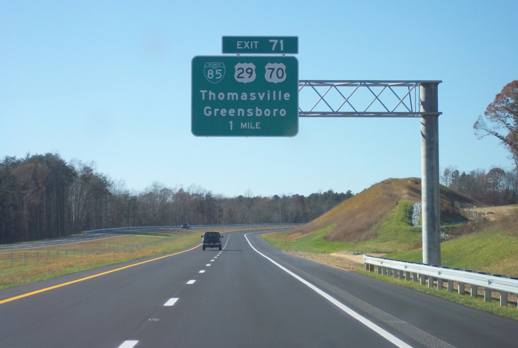 Photo of sign for Business 85 exit off of I-74 west near the Jackson Lake 
Rd Bridge, Nov. 2010 Courtesy of Adam Prince