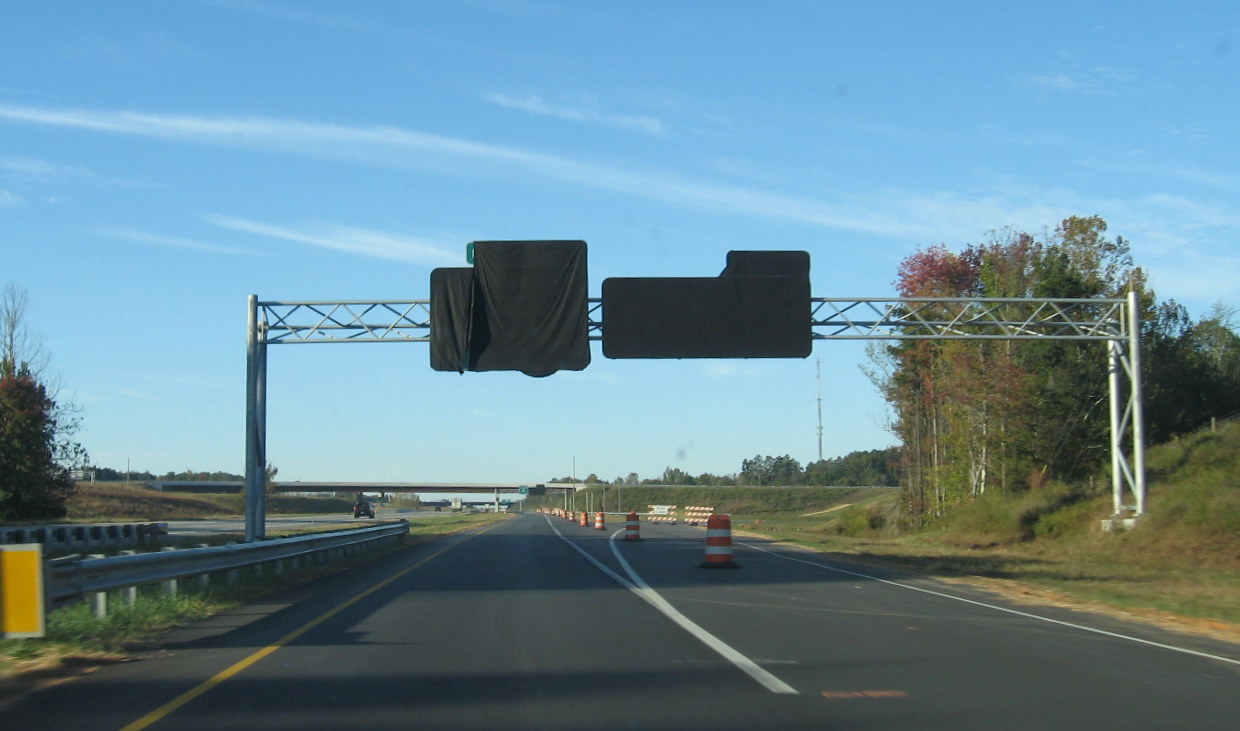 Photo of covered I-74 East and West exit signs from I-85 North, Oct. 
2010