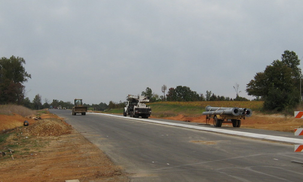 Photo of Cedar Square Road looking west from I-74 freeway toward existing 
US 311 near Glenola, Oct. 2009