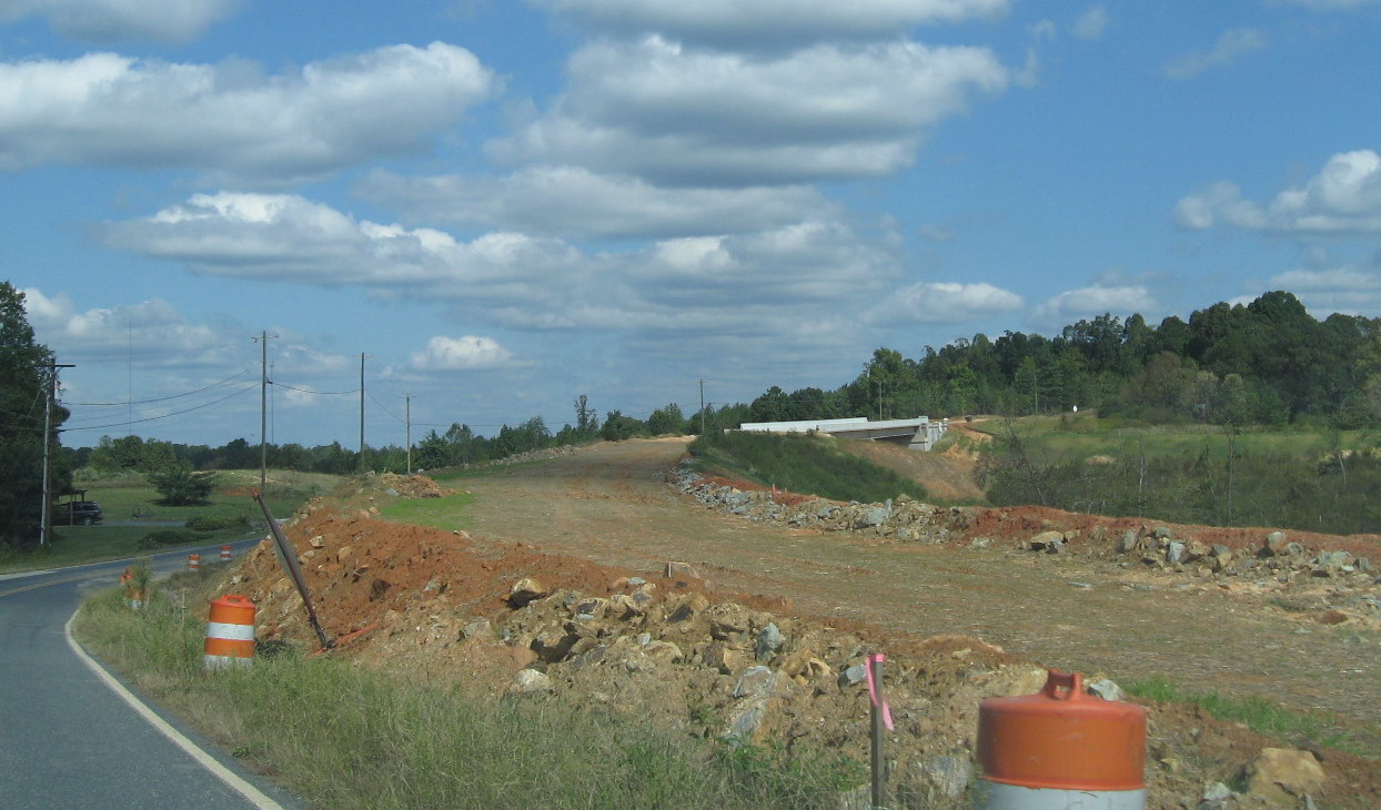 Photo approaching Heath Dairy Road bridge from the west showing roadbed 
still under construction over future I-74 freeway near Randleman in Oct. 2011