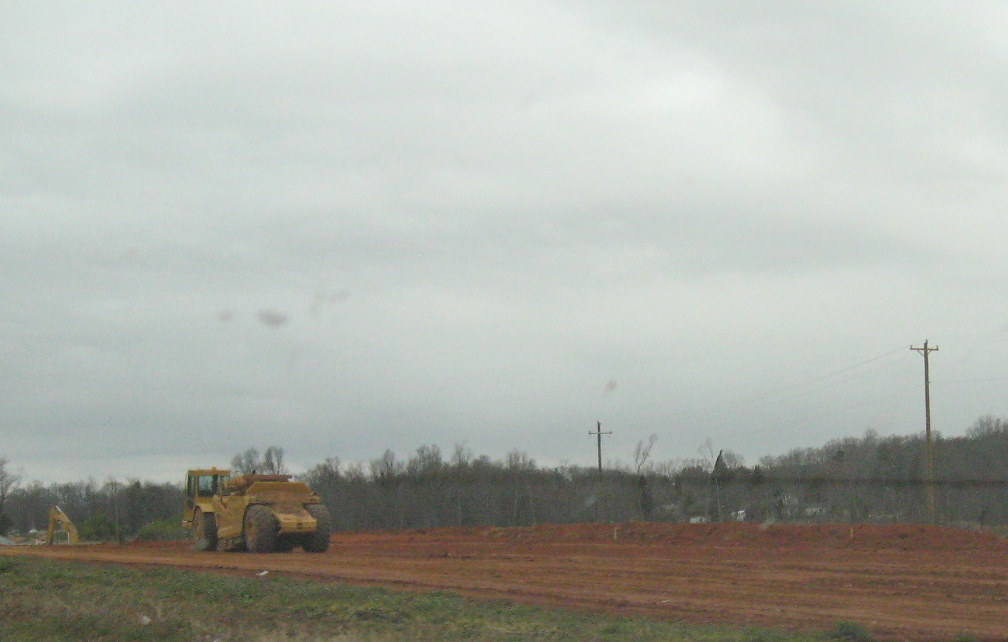 Photo of progress grading roadway near US 311 bridge over future I-74 freeway 
in Sophia, July 2010