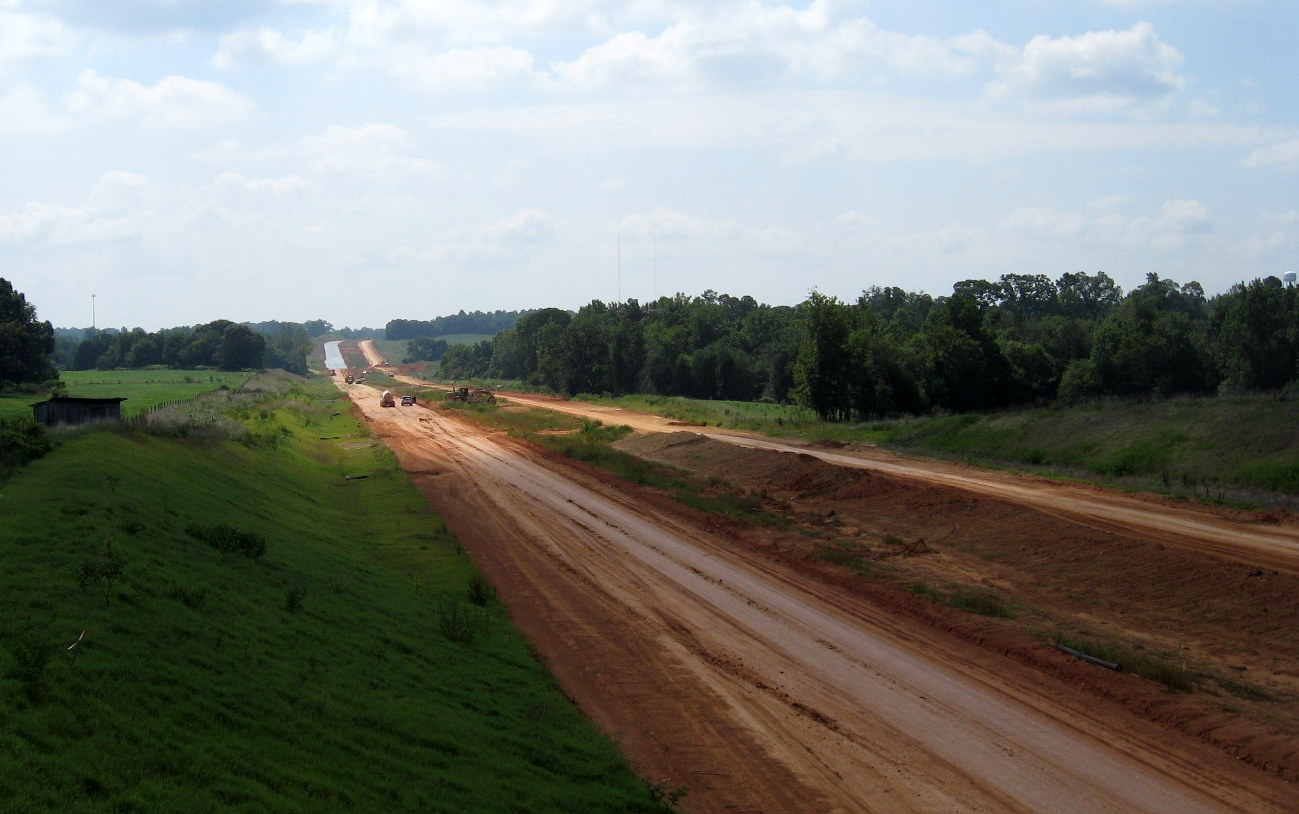 Photo of view looking south from Banner Whitehead Rd Bridge showing progress 
in building I-74 Freeway in Aug. 2012