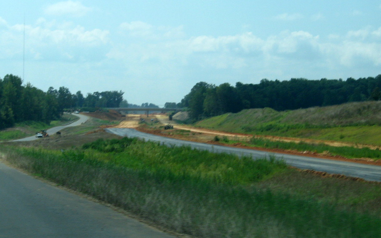 Photo of Branson Davis Rd Bridge showing progress in excavating under for 
future I-74 freeway roadbed in Aug. 2012