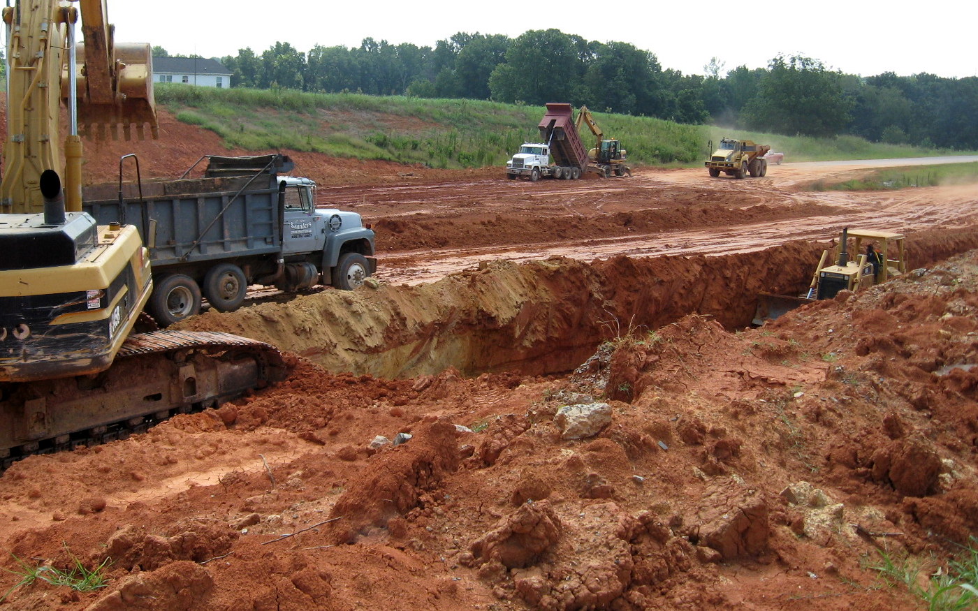 Photo showing progress in removing soil from under completed Walker Mill Rd 
Bridge for future I-74 freeway in Aug. 2012