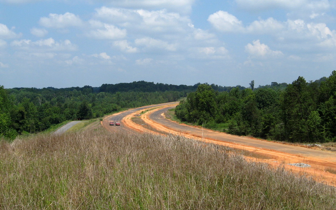 Photo of view north of Plainfield Rd Bridge showing progress in completing the 
future I-74 freeway roadbed in Aug. 2012