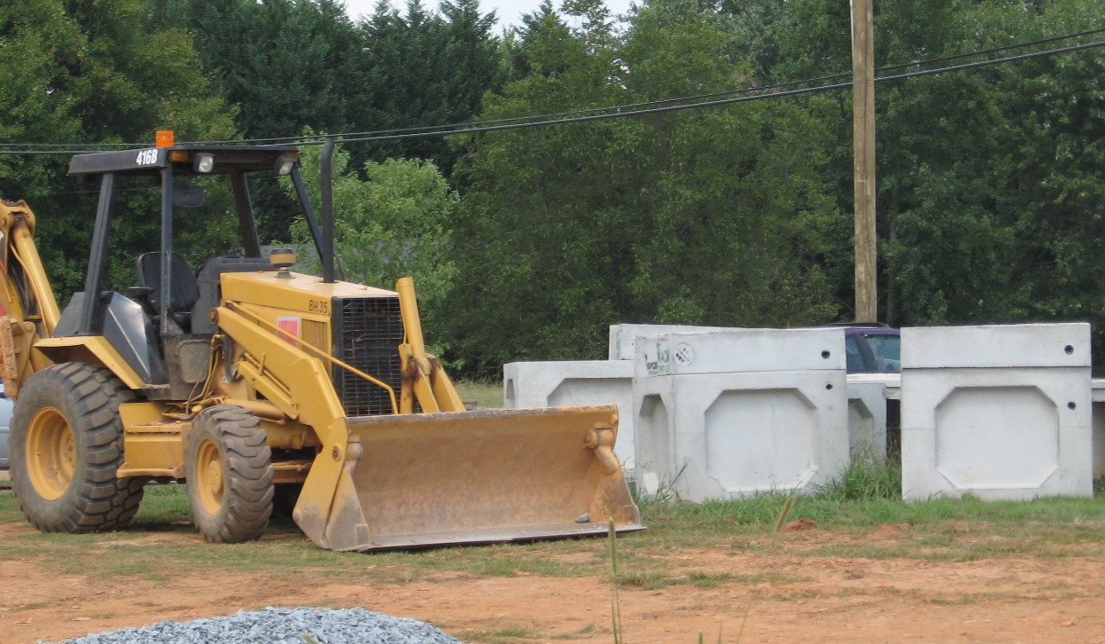 Photo from Walker Mill Road showing box culverts and gravel awaiting their 
placement on the temporary roadway to keep road open while bridge over future I-74 freeway is built, Aug. 2010