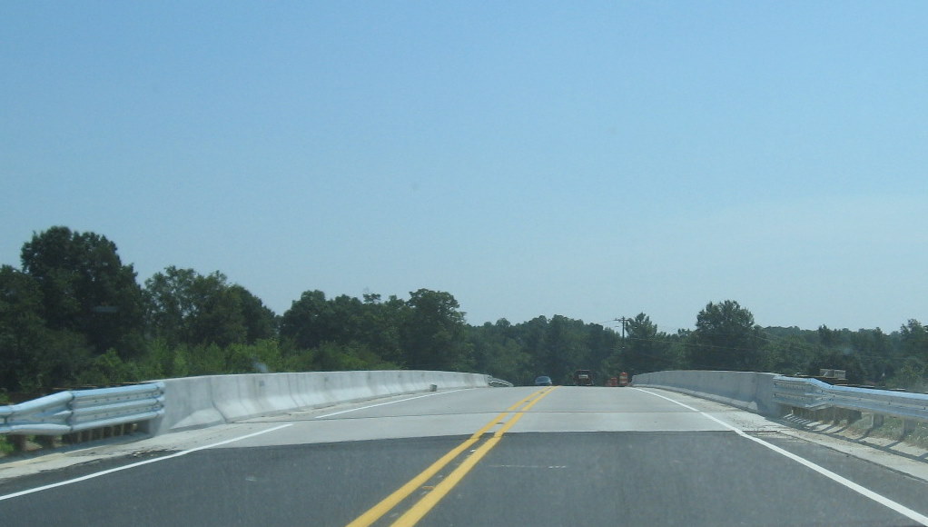 Photo of driving over the opened NC 62 bridge showing work remaining in July 
2009