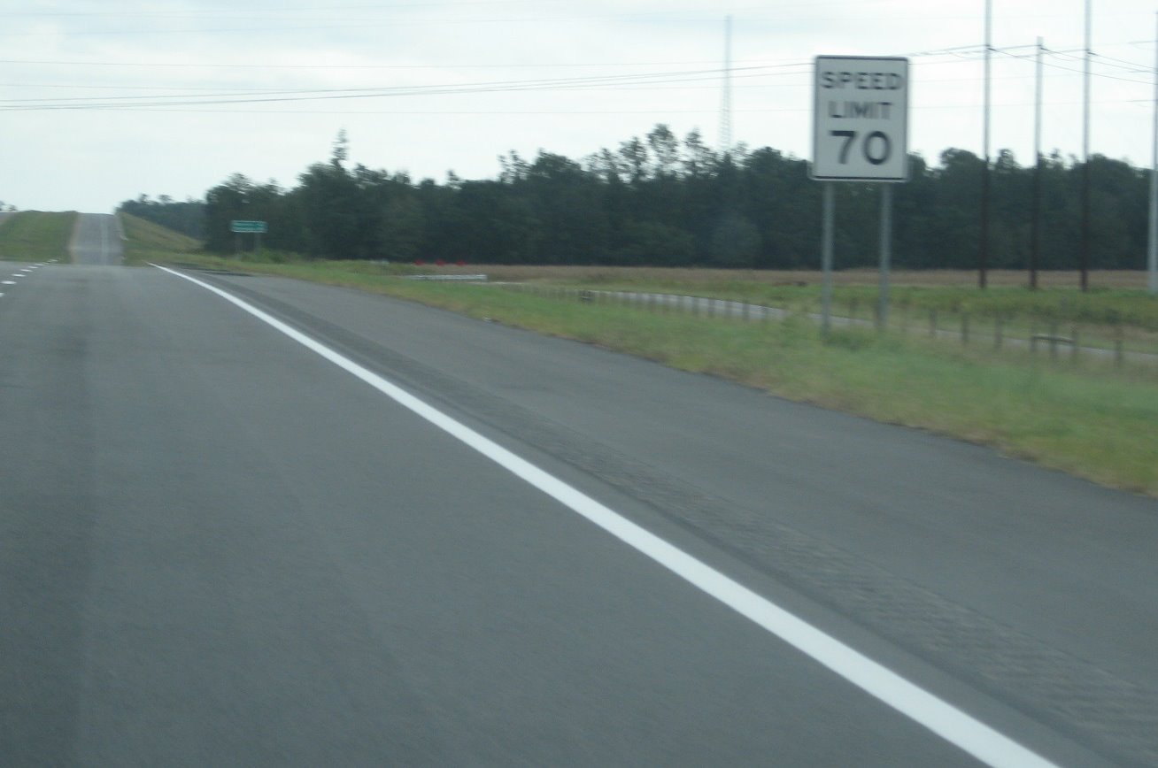 Photo of Speed Limit 70 sign on new section eastbound after NC 710 exit, Sept. 
2008