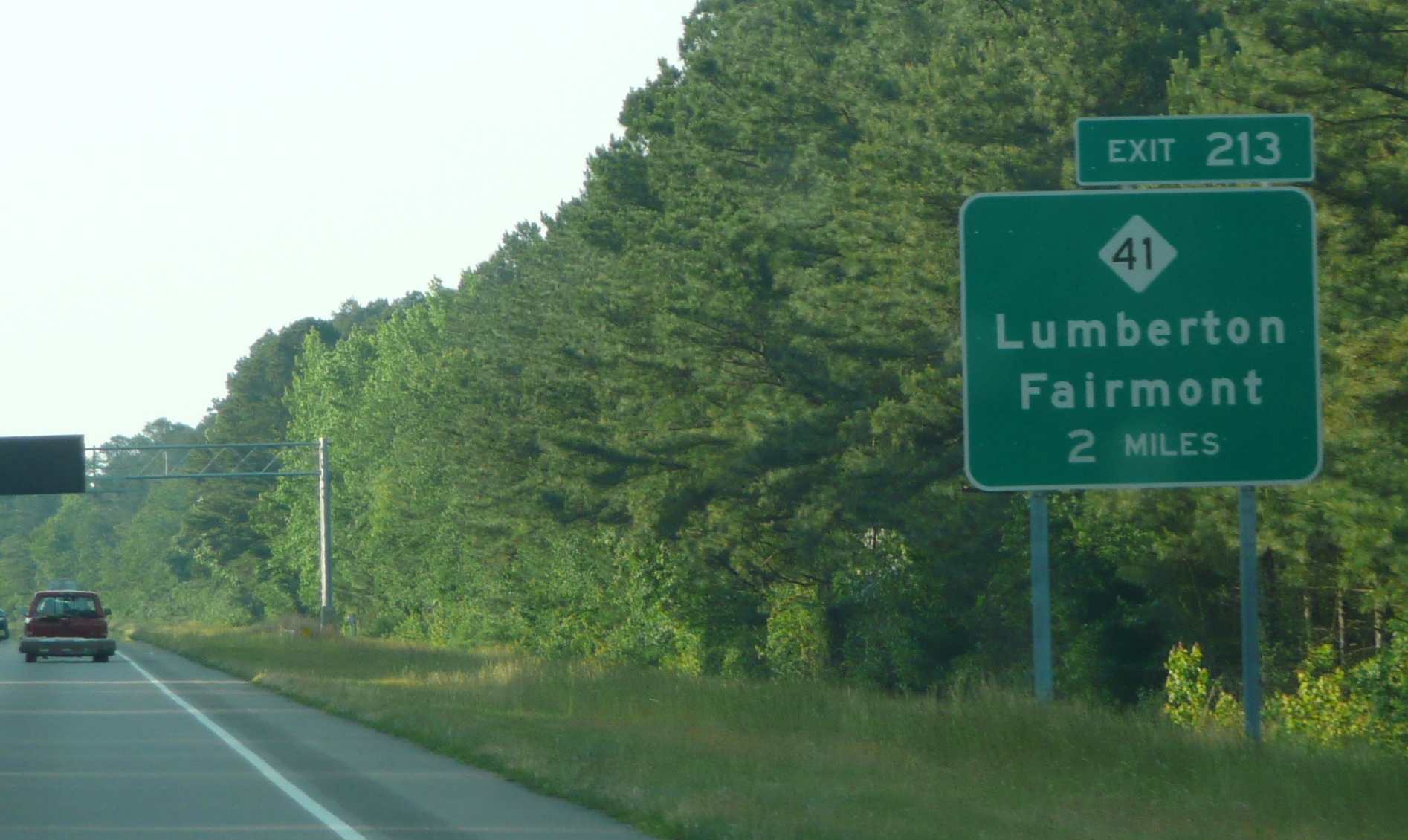 Photo of the first numbered exit sign for I-74 on US 74 West for NC 41, May 
2009