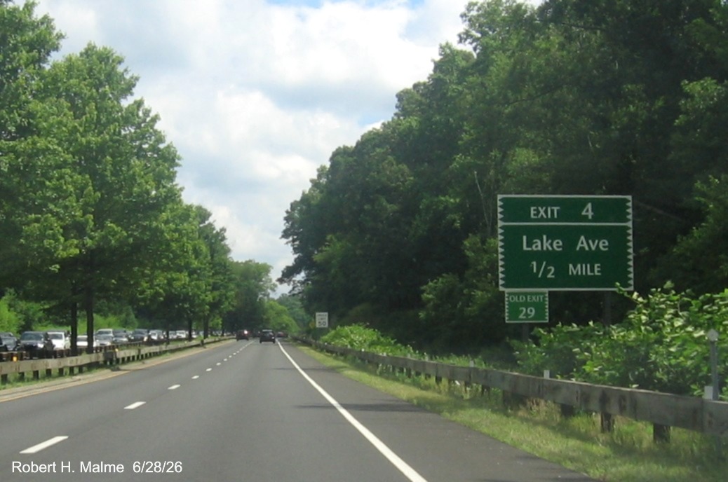 Image of 1/2 Mile advance sign for the Lake Avenue exit, with new milepost based number 
 and green Old Exit 29 sign below on CT 15 North/Merritt Parkway in Greenwich