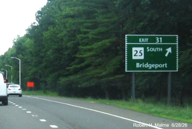 Image of ground mounted ramp sign for the CT 25 South exit, with new milepost based exit 
 number and Old Exit 49S sign on support post on CT 15 North/Merritt Parkway in Bridgeport, by Jay Hogan, October 2025
