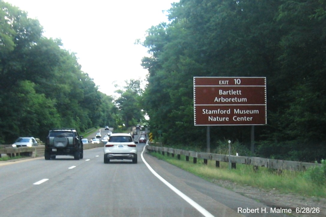 Image of brown auxiliary sign for the CT 137 exit, now with new milepost based exit number 
  on CT 15 North/Merritt Parkway in Stamford