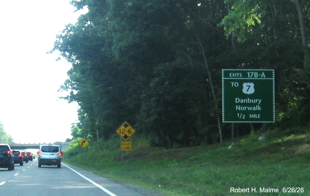 Image of 1/2 Mile advance sign for the To US 7 North exit, now with new milepost based exit 
 numbers on CT 15 South/Merritt Parkway in Norwalk