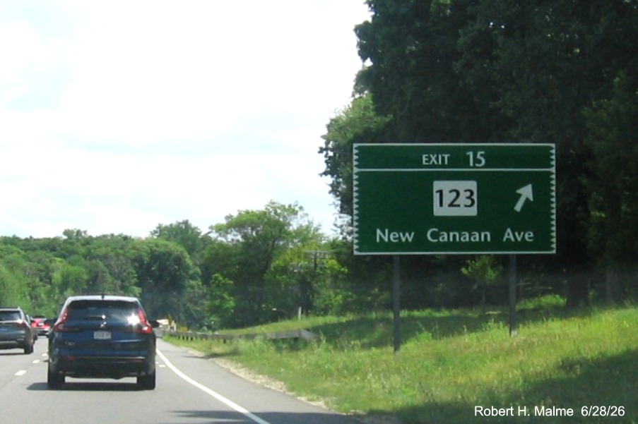 Image of ground mounted ramp sign for the CT 123 exit, now with new milepost based exit number 
 on CT 15 North/Merritt Parkway in Norwalk