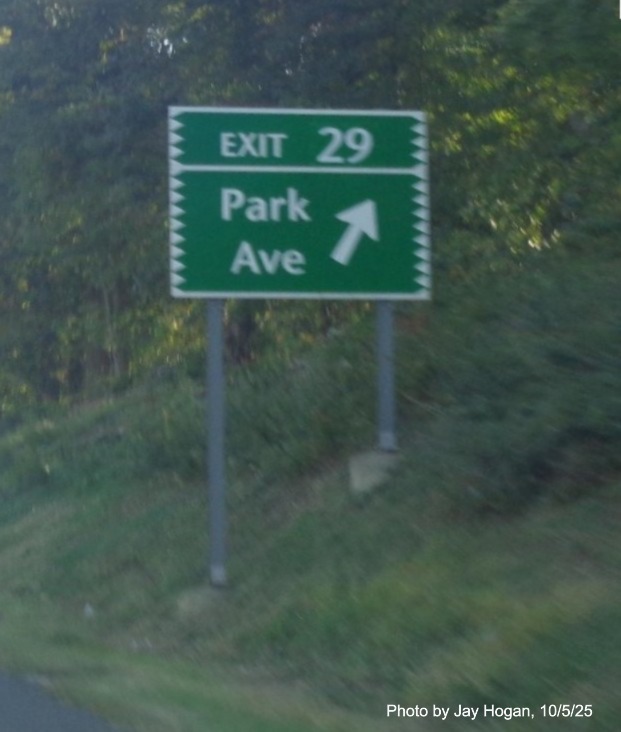 Image of ground mounted ramp sign for the Park Avenue exit, with new milepost based exit 
 number and Old Exit 47 sign on support post on CT 15 North/Merritt Parkway in Fairfield, by Jay Hogan, October 2025