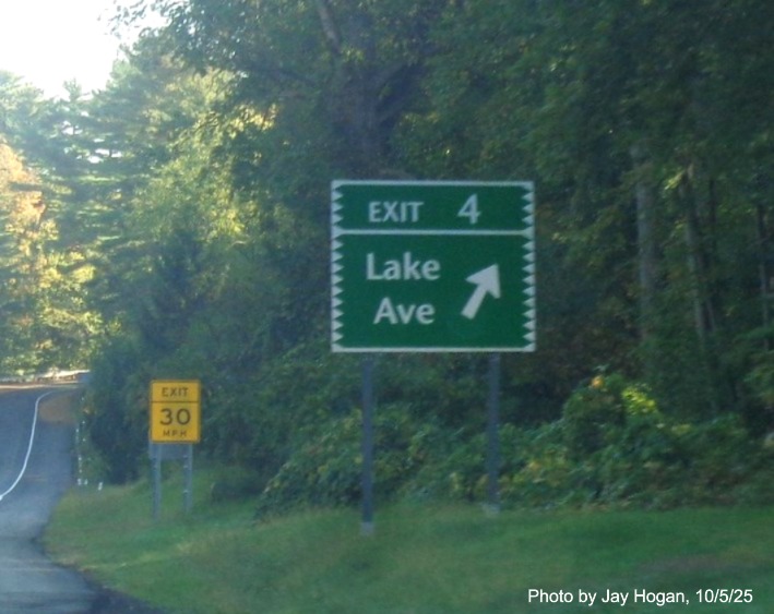 Image of exit sign for the Lake Avenue exit, with new milepost based number 
 on CT 15 North/Merritt Parkway in Greenwich