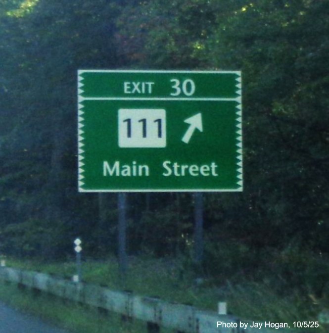 Image of ground mounted ramp sign for the CT 111/Main Street exit, with new milepost 
 based exit on CT 15 North/Merritt Parkway in Bridgeport, by Jay Hogan, October 2025