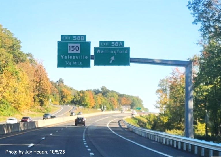 Image of ground mounted advance sign for the Wallingford and CT 150 exits, with
 new milepost based exit number overlays on exit tab on CT 15 North/Cross Parkway in Wallingford, by Jay Hogan, August 2025