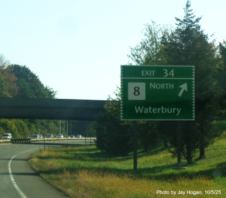 Image of ground mounted ramp sign for the CT 8 North exit, with new milepost based exit 
 number on CT 15 North/Merritt Parkway in Bridgeport, by Jay Hogan, October 2025