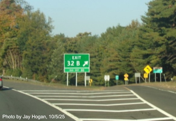 Image of ground mounted gore sign for the CT 127 exit, with new milepost 
 based exit number and green Old Exit 50 tab below on CT 15 South/Merritt Parkway in Trumbull, by Jay Hogan, October 2025